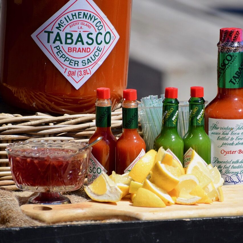 display table, food, food stall, lemon slices, lemons, food market, market stall, sauce, sauces, tabasco sauce, hot pepper sauce, outdoors, tabasco sauce, tabasco sauce, tabasco sauce, tabasco sauce, tabasco sauce